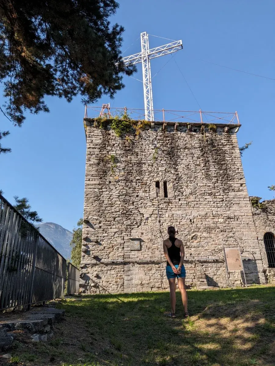 Linda stands infront of the tower of Castello di Mattarella