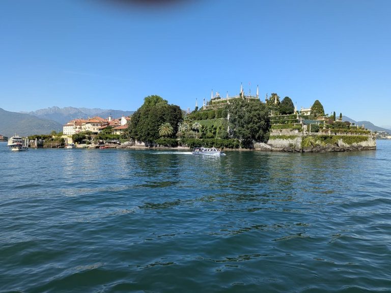 Isola Bella rises from Lake Maggiore with its grand Borromeo gardens, historic buildings and mountain backdrop, making it a standout stop on any Borromean Islands day trip.