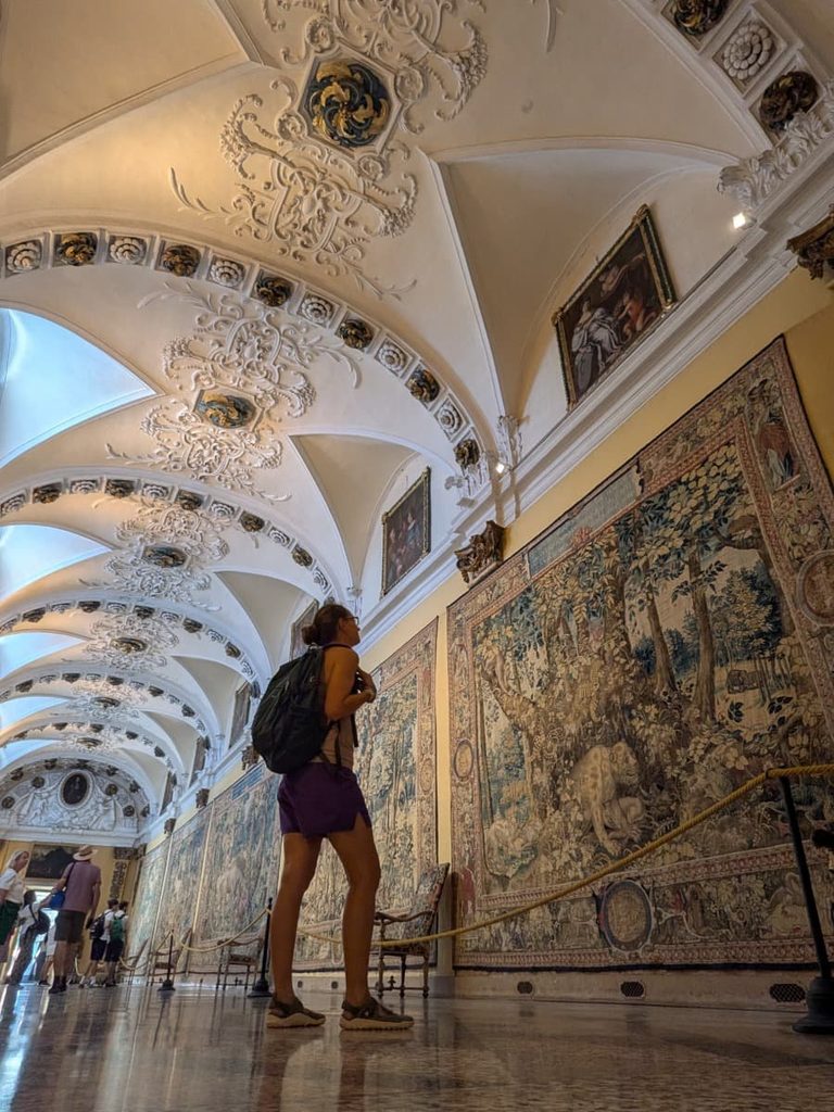 Inside Palazzo Borromeo on Isola Bella, Linda admires richly decorated vaulted ceilings and historic tapestries during a visit to the Borromean Islands.